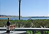 Gorgeous view of the bay channel. Sit and enjoy watching the boats going out the ocean. It might inspire you to book a fishing charter just a few blocks away!
