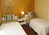 3rd bedroom with two twin beds and TV