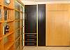This bedroom can be used as a bedroom or office since it has a fold up murphy bed and built in desk.