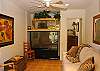This ground floor bedroom doubles as an extra living area with large screen TV and fold out queen sofa sleeper. Cable TV/SHO/HBO/DVR/TUNER. French doors open out to private patio area.