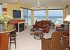 Living room with large HDTV/DVD
There are 2 balconies off to each side of the room with Gas BBQ on south side.