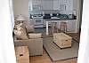 living room has a sofa , TV and end tables and a coffee table with storage.