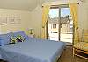 Bedroom has access to a beautiful outside balcony with ocean views.
