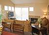 Living room with doors leading to the balcony that has Gas BBQ