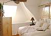 Master bedroom has vaulted ceilings and skylight with balcony and peak view of Mission Bay.
