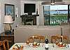 Great views from both the living and dining area with a cozy fireplace to keep you warm in the winter months.