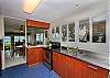 Main kitchen in the front of the home which has the 2 bedrooms