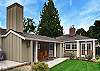 Completely fenced, lush green yard, three patio areas and an outdoor fireplace!
