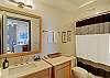 Large bathroom with full bathtub/shower and plenty of counter space.  All linens included!