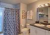 Large full bathroom with plenty or pool towels and bath towels.