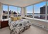 Queen size bed plus cable television in the bedroom.