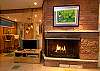 Wrap-around, wood burning fireplace.
