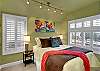 Queen size bed with pass through bathroom.