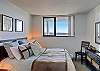 Master Bedroom overlooks balcony.