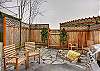 Private, landscaped backyard with gas grill.
