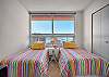 Twin bedroom features water views.  Twin beds can be made up as a king bed upon request.