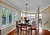 Bright Dining Room seats up to six people and overlooks the Living Room.