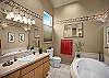 Jacuzzi tub and separate shower.
