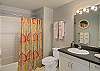 Large bathroom adjacent to second bedroom.