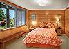 Queen size bed with views of the stunning gardens and puget sound!