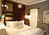 Sleeping alcove with luxurious king size bed and down bedding.