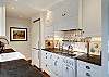 Galley style kitchen with Chambers stove.