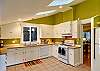 Large kitchen with modern appliances and all the kitchen necesseties including a blender, french press, coffee grinder and more!