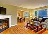 Gas fireplace, flat panel television and comfortable seating in the main floor Living Room.