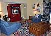 Nicely appointed living area with wood flooring