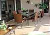 Outdoor screened patio dining.