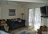 Spacious living room with flat screen TV! Deck access.