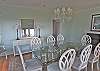 The dining table easily seats 8 guests and has ocean views!