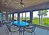 Enjoy oceanfront dining from this screened porch