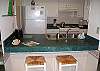 Enjoy a quick bite or cup of coffee at the bar. Well stocked kitchen allows guests to enjoy in house dining