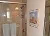 Tile shower/tub combo located on second floor