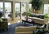 Formal living room with access to large screened porch