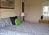 Master bedroom features a king bed with full bath and a private deck access