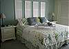 Enjoy this well appointed bedroom with king bed, TV and private bath