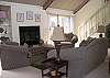 Formal living area with vaulted ceiling and access to the deck