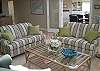 The formal living area has a large sectional sofa and large Proscan TV.  There is a stereo receiver here too.