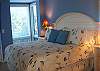 Bedroom features king bed and private bath
