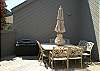 Large, spacious deck with large outdoor dining table, gas grill and lounge chairs