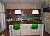 Stainless counters, social bar and gas range