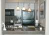 Updated kitchen with granite tile countertops.
