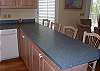 Fully equipped kitchen opens to dining area