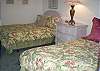 This bedroom offers two double beds a TV and full bath with tub/shower combo