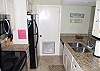 The kitchen has stainless appliances, granite counter tops and custom cabinets