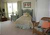 Third bedroom offers two twin beds and deck access
