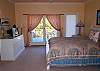 Another view of the queen bedroom, see the open deck. It has exceptional views