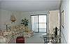 Comfortably furnished living area with deck access